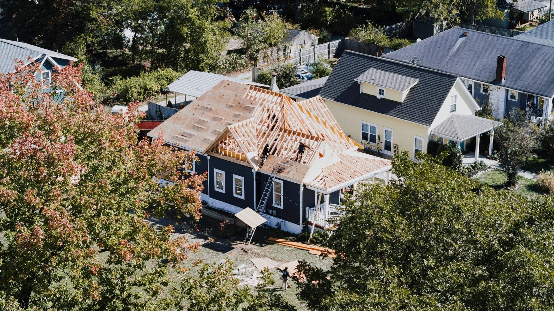 Aerial view of an exterior addition being framed on a Vermont home