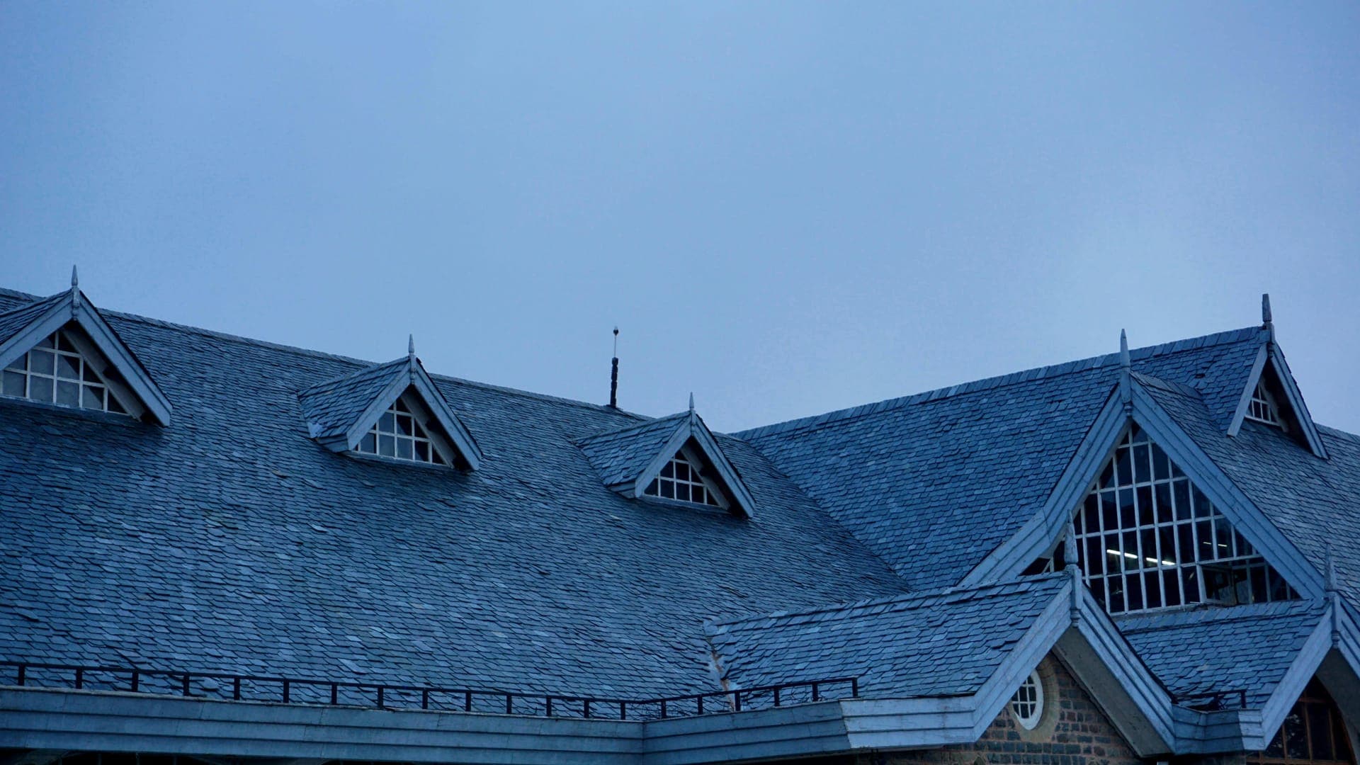 Detail of a multi-section slate roof on a historic Vermont home