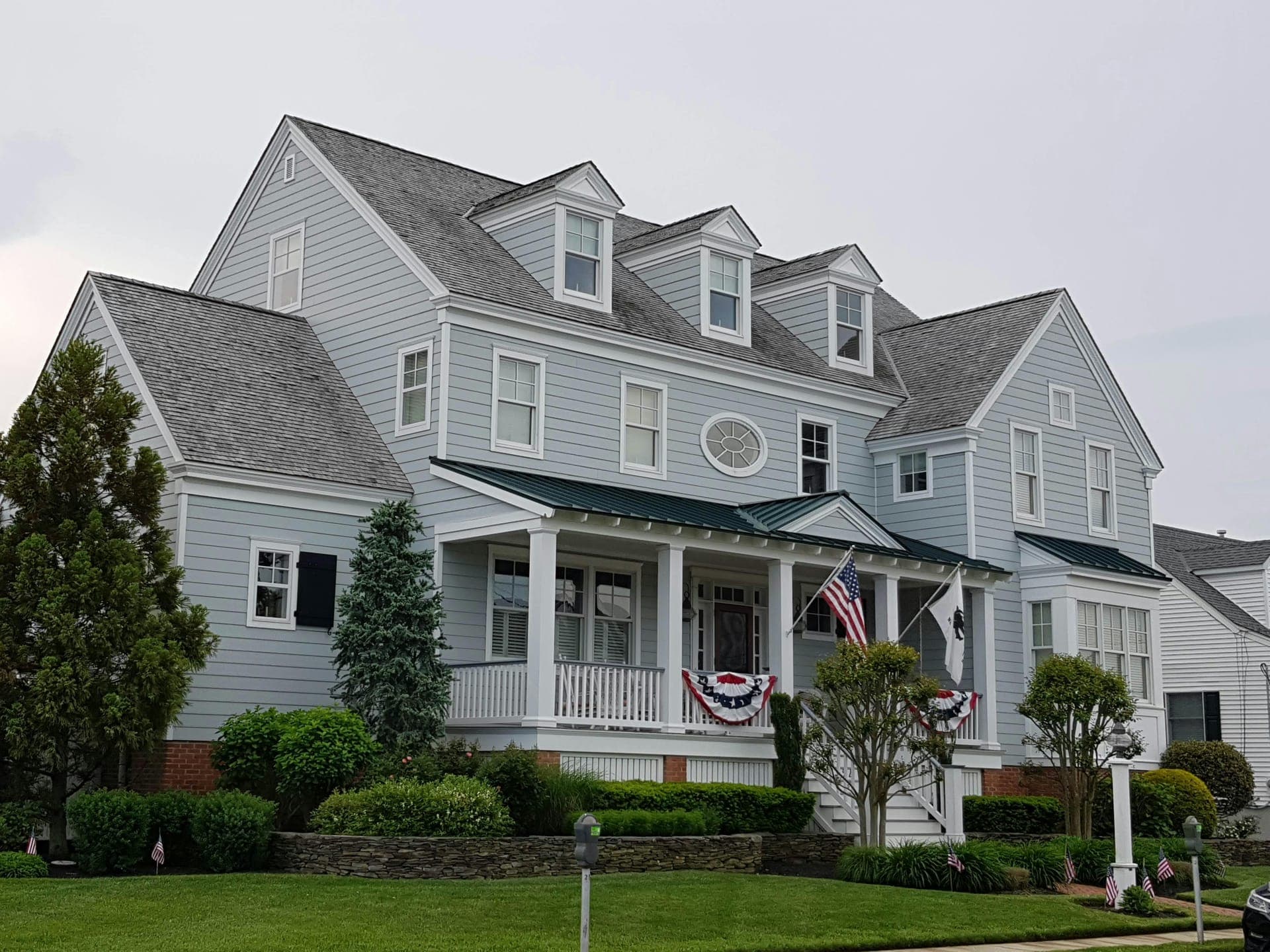 Light-blue vinyl siding on a multi-gable Vermont home