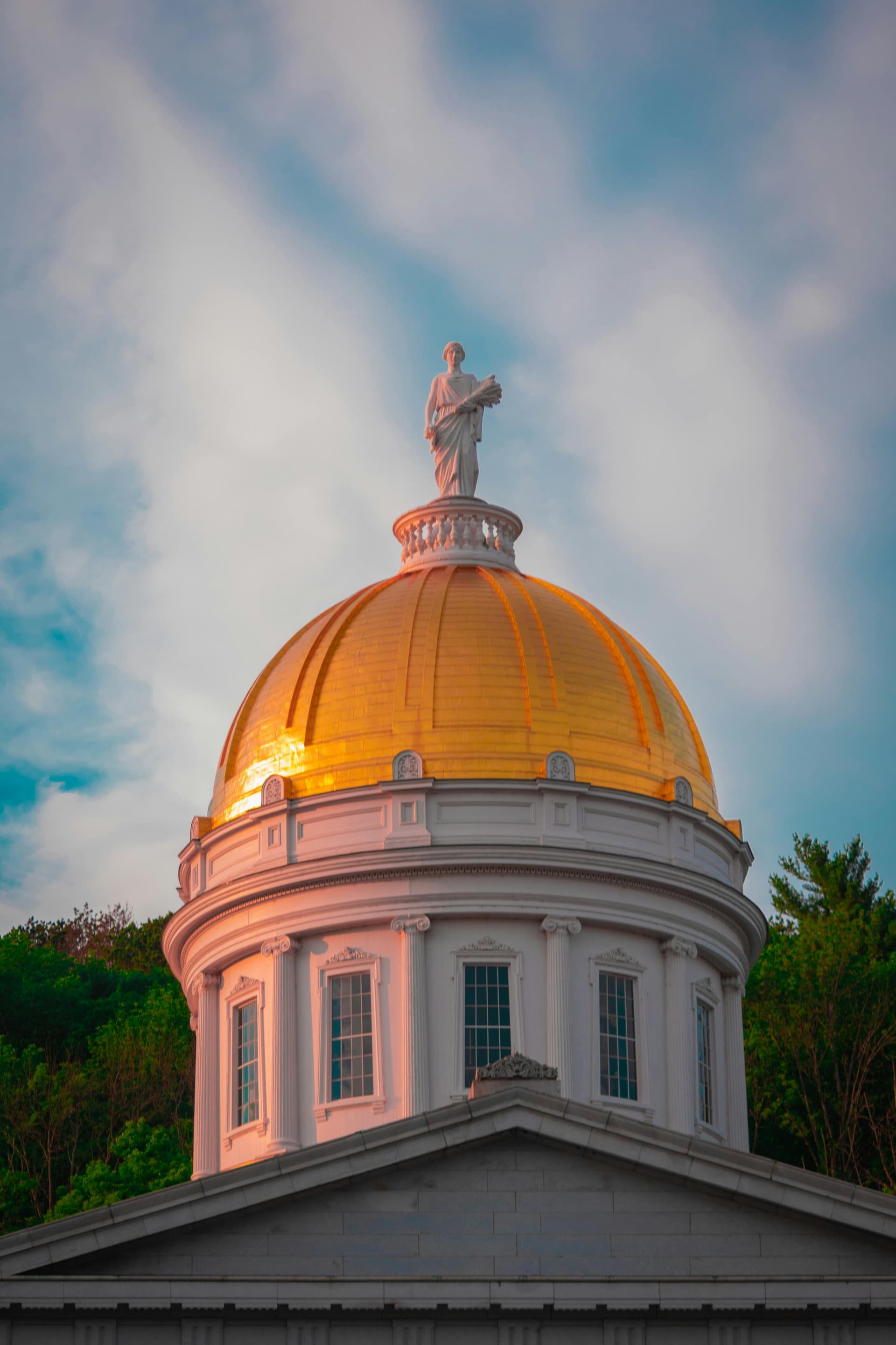 Vermont State House gold dome at golden hour